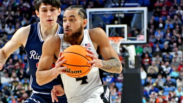 Mar 19, 2022; Buffalo, NY, USA; Providence Friars guard Jared Bynum (4) drives to the basket against Richmond Spiders guard Andre Gustavson (22) during the second half during the second round of the 2022 NCAA Tournament at KeyBank Center. Mandatory Credit: Mark Konezny-USA TODAY Sports
